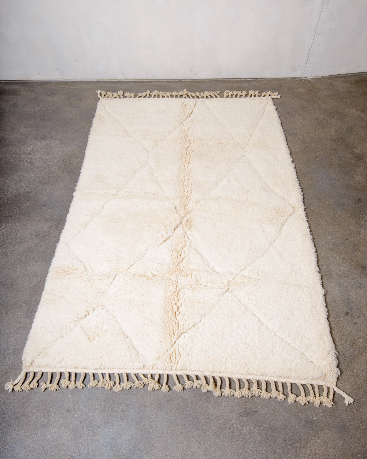 Modern, designer, handcrafted Berber rug from Morocco. Beniourain carpet with minimalist design, natural wool pile and a fluffy texture.